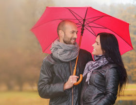 Happy man and woman in the park