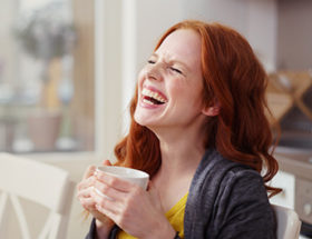 Woman having hysterics at a joke