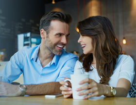 Couple sharing questions in a cafe