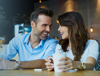 Couple sharing questions in a cafe