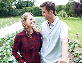 Farming couple in the veggie patch