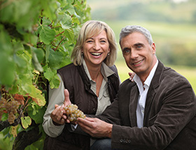 Couple visiting a vineyard for a wine tasting
