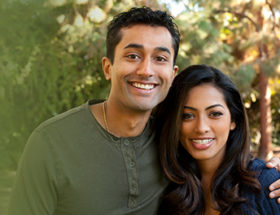 Sweet young Indian couple hugging each other outside