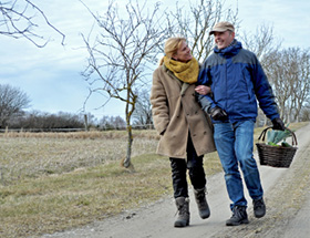Older couple off for a picnic