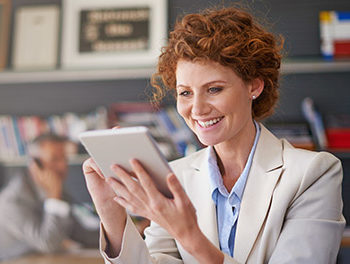 Woman looking at photos on a tablet