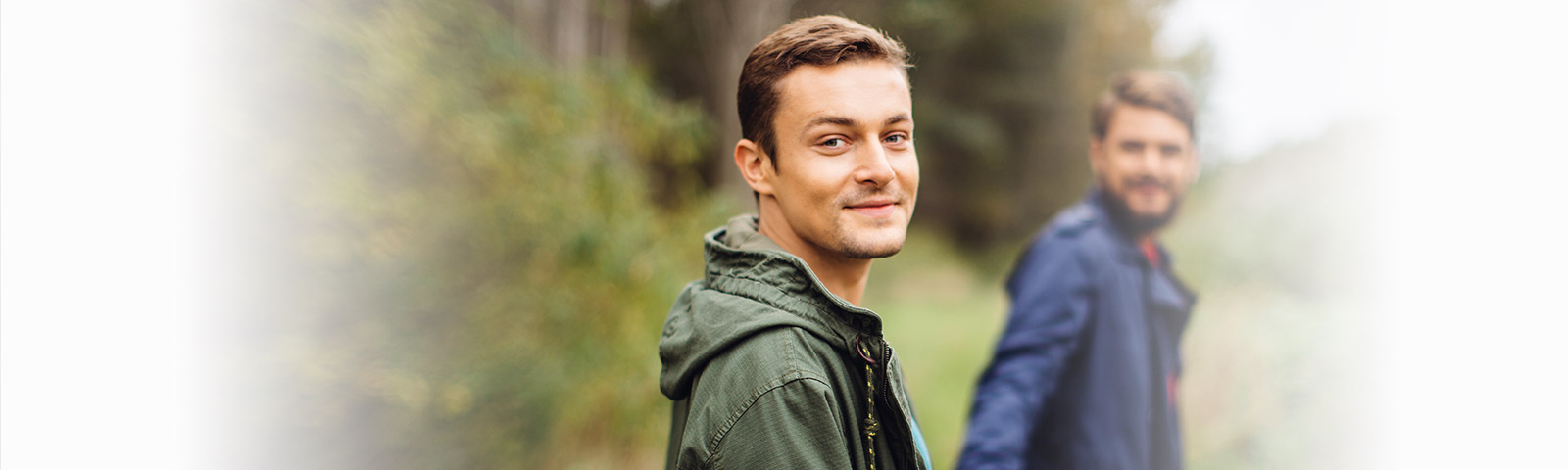 Man and his boyfriend walking in the woods