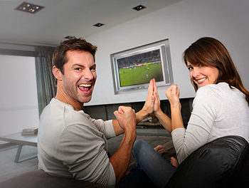 Couple watching rugby