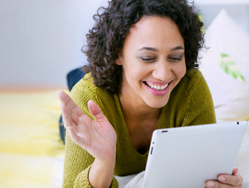 Woman using her tablet to flirt online