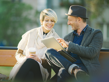 Couple flirting on a bench